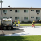 Workers whitening a street in LA as part of the city’s “cool pavement” program to reduce the urban heat island effect. Image: Nate Berg